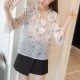 Floral Printed Ruffled Tie Collar Quarter Sleeves Shirt- White Floral Printed Ruffled Tie Collar Quarter Sleeves Shirt- White | Image